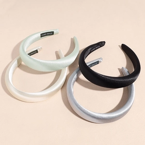 Padded satin headbands in mint, beige, black, and silver grey with handmade labels