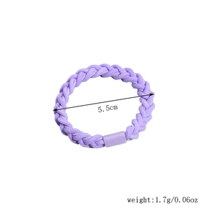 Detail of purple woven hair tie with a matching plastic buckle and 5.5cm diameter size