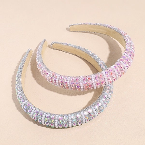 Padded headband with sparkling rhinestones and white pearls in pink and silver colors