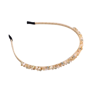 Elegant champagne gold headband with glittering rhinestone crystals for a luxury look