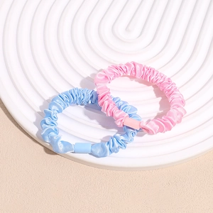 Pink and light blue satin scrunchies set with soft pleats for ponytails and buns