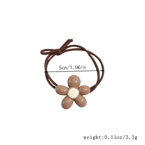 Detail of coffee flower elastic hair tie showing 5cm diameter and 3.3g weight specs