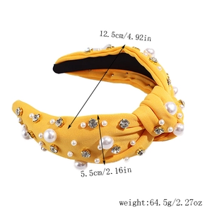 Yellow knotted headband with faux pearls and crystals showing size 12.5cm and 5.5cm