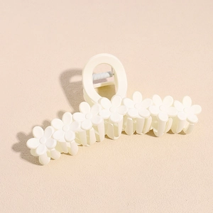 Detail of 13cm white matte hair claw clip with cute 3D floral pattern and metal spring