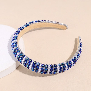 Detailed macro view of luxury padded headband with blue rhinestones and white pearls