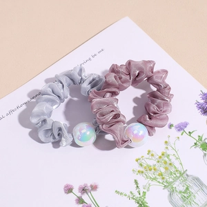 Iridescent pearl mesh scrunchies in silver and rose pink with pleated organza finish