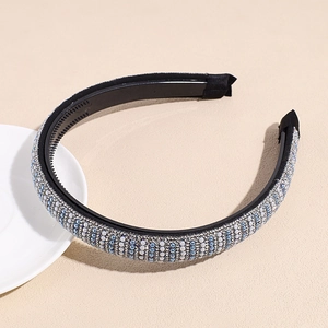 Close-up of handmade pearl headband featuring vertical blue and white beaded textures