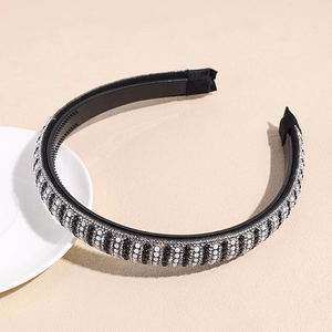 Detailed view of handmade baroque headband with black and white pearl bead stripes