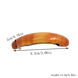 Detail view of leopard print acetate hair clip showing dimensions of 9.3cm in length