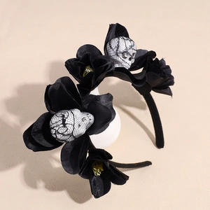 Gothic Halloween headband with black artificial flowers and lace-wrapped skulls decor