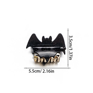 Detailed view of black glitter bat hair claw with gold metal clips and size dimensions