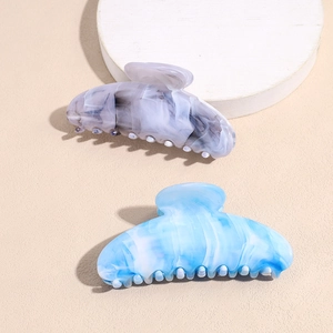 Elegant acrylic hair claw clip with marble texture in grey and blue celestial colors