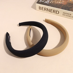 Set of two thick padded sponge headbands in black and khaki with handmade woven label