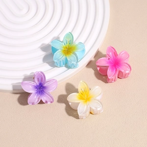 Set of four colorful plumeria flower hair claws in pastel resin with metal spring