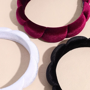 Thick velvet padded headbands in burgundy, white, and black with pleated floral texture