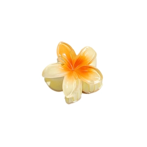 Frangipani flower hair claw clip in orange and yellow gradient for summer