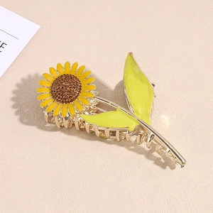 Elegant sunflower metal claw clip with yellow petals and rhinestones for women