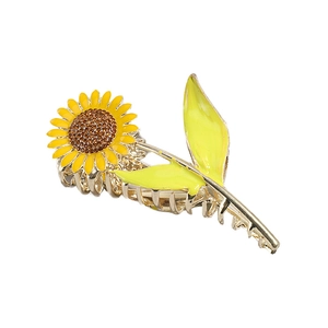 Elegant gold metal sunflower hair claw clip with yellow petals and sparkling crystals