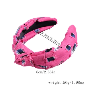 Pink denim knotted headband featuring plaid patches and frayed edges with measurements