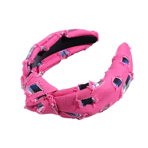 Chic knotted denim plaid headband in magenta with distressed details and vintage style