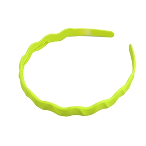 Neon yellow wavy headband with non-slip inner teeth for secure hair styling