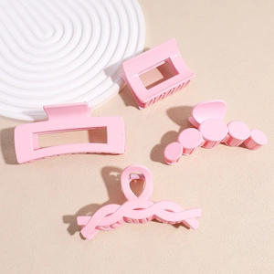 Set of 4 matte pink hair claw clips in various geometric designs for women and girls