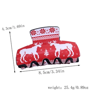 Detailed view of square Christmas acrylic hair claw with reindeer and snowflake patterns