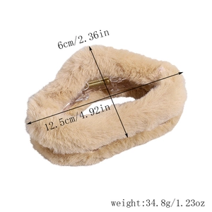 Detail showing plush hair claw clip dimensions 12.5cm by 6cm and product weight info