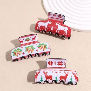 Three-piece Christmas acrylic hair claw clips with reindeer and holiday bell prints