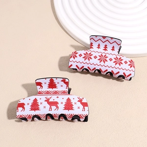 Set of two large acrylic Christmas hair claws with reindeer and snowflake patterns