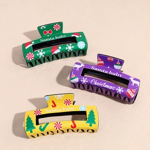Three Christmas themed large shark hair clips with festive trees and reindeer patterns
