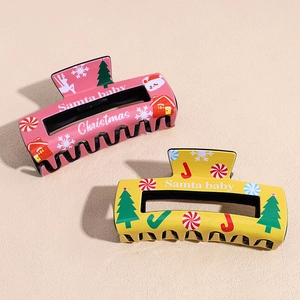 Pink and yellow Christmas hair claw clips with festive cartoon prints for women's hair styling
