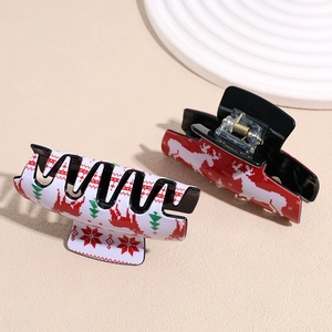 Christmas theme acrylic hair claws with reindeer and snowflake pixel patterns in red and white