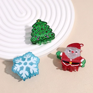 Glitter Christmas hair claw set with green tree red Santa and blue snowflake designs