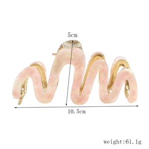 Pink marble acetate hair claw clip with gold base showing dimensions 10.5cm by 5cm