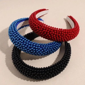 French vintage wide pearl headbands in red blue and black set on minimalist background