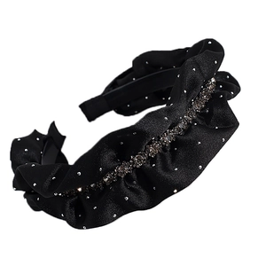 Elegant wide black pleated satin headband with dark rhinestones in a wavy design