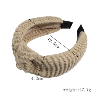Detail of chunky knit headband with twisted knot design and size dimensions shown