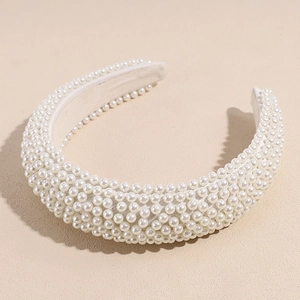 Detailed view of the dense artificial pearl inlay and inner lining of the sponge headband