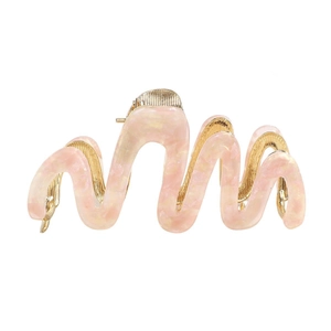 Pink acetate hair claw clip with gold wavy metal frame on white background