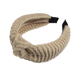 Knitted khaki knot headband with wide brim and soft ribbed texture for autumn winter