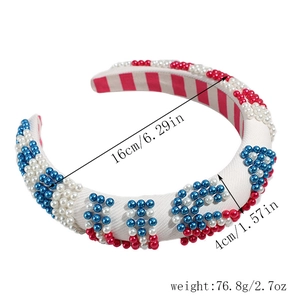 Detailed view of padded headband with USA pearl embellishment and striped inner lining