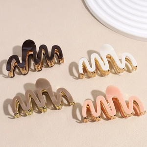 Stylish wavy acetate hair claws with gold metal clips in assorted elegant colors