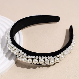 Detail of vintage Baroque headband with pearls on black velvet fabric base