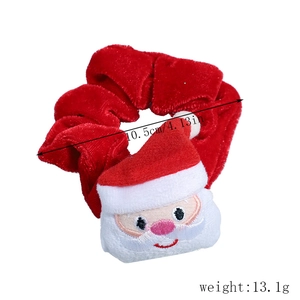 Detail of red velvet Santa Claus scrunchie showing 10.5cm size and 13.1g weight specs