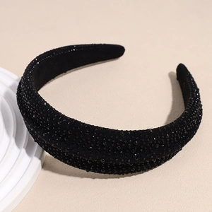 Close-up of handmade black beaded headband with luxury rhinestone details and thick velvet base