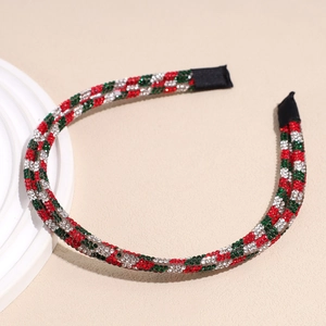Detail of double-layer Christmas headband with festive red, green and white rhinestones