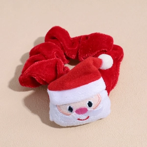 Close-up of red velvet Christmas scrunchie with 3D Santa Claus plush embroidery detail