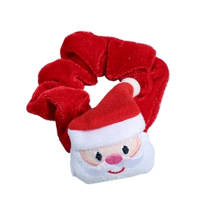 Red velvet Christmas scrunchie featuring a 3D plush Santa Claus holiday hair accessory