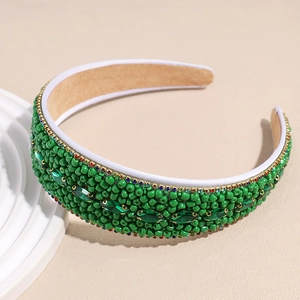 Close-up of green beaded headband featuring marquise gemstones and colorful rhinestones